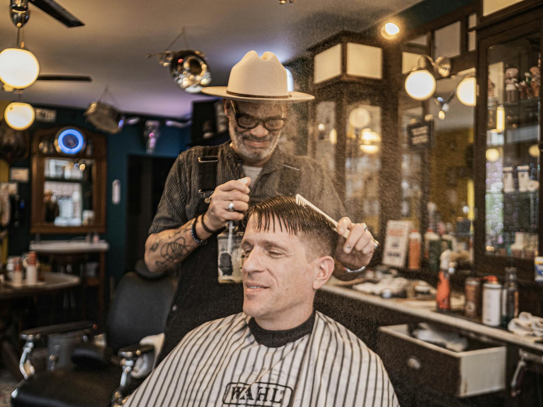 Vintage barbershop interior with classic barber chairs and warm lighting